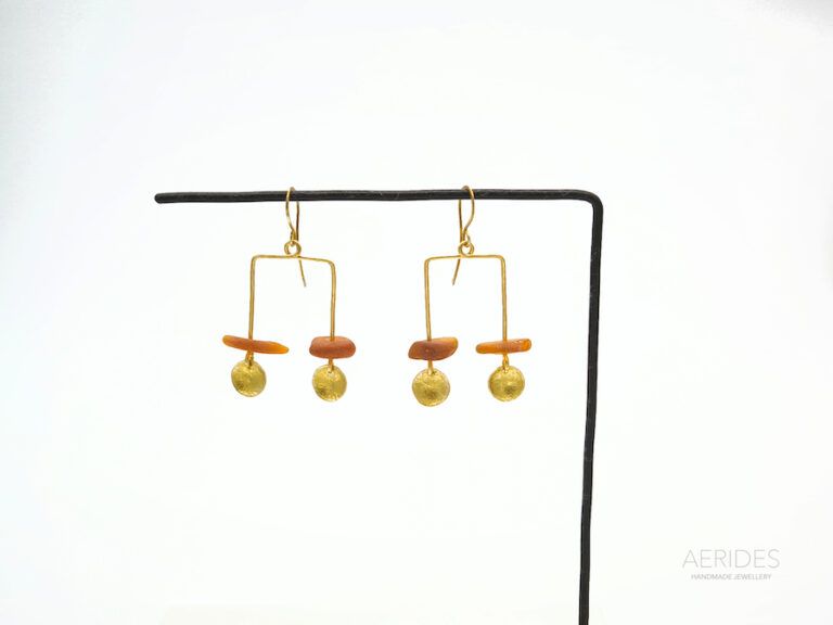 a pair of earrings handmade with,light brown sea glass that i have collected from navarino bay