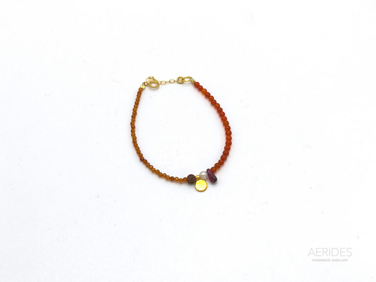 Silver gold-plated handmade bracelet with sandstone,carnelian,garnet and lava .